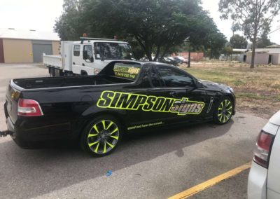 The workshop Simpson Signs ute with a body wrap promoting Simpson Signs