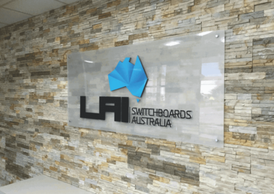 Indoor wall mounted glass sign with 3 D lettering