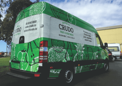 A Mercedes van that has been body wrapped in corporate colours and descriptive drawings