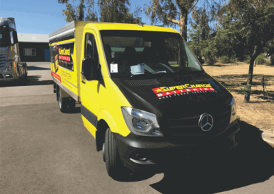A Mercedes van that has been body wrapped in strikingly contrasting Colours