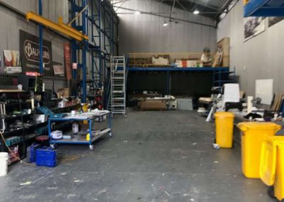 The sign writing work shop area is very long because it has to accomodate semi trailers and depending on the amount of time applying the signage might take, the trailer and the semi cabin might need to be locked into the workshop overnight