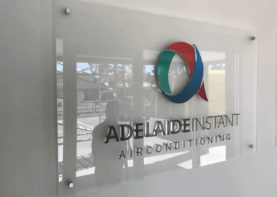 Indoor wall mounted glass sign with 3 D painted glass lettering