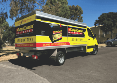 A specialist delivery van features signage on all sides
