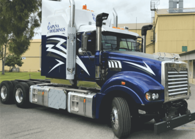 A striking sign-writing job on this large semi-trailers cabin shows the company name, sign written, plus large vinyl cut transfers, featuring lightning strikes