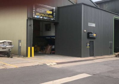 The entrances to Simpson Signs Showing two large entrance roller shutters allowing access for the biggest trucks
